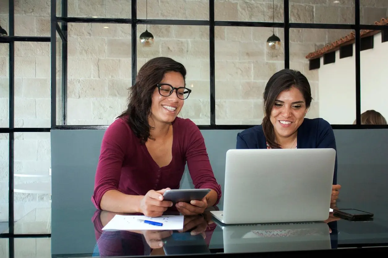 Colleagues collaborating at a desk